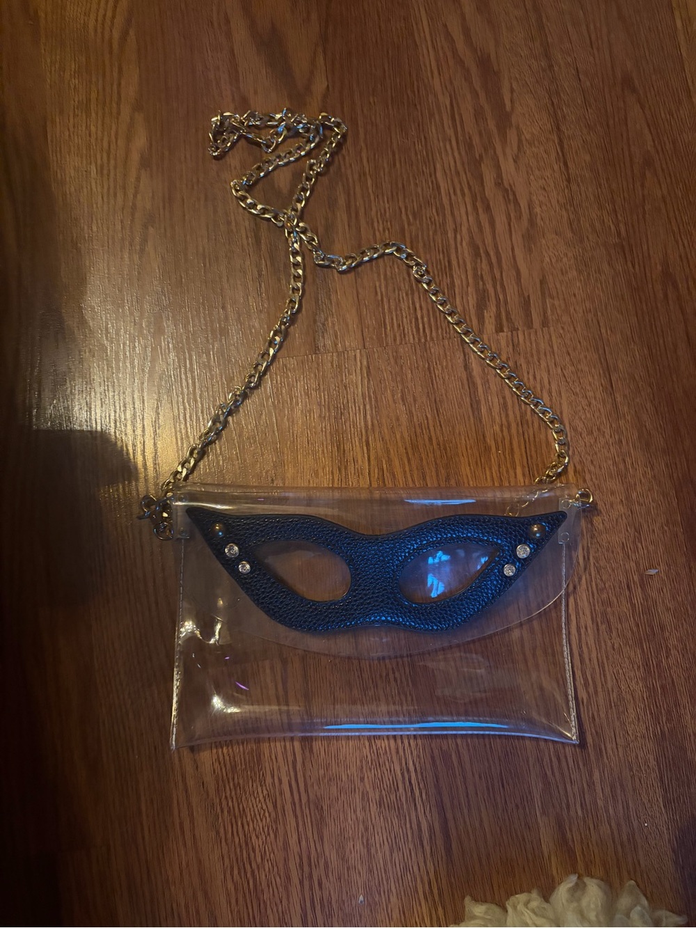 Clear Crossbody Bag with Black fetish Mask Accent and Gold Chain